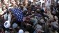 Afghan demonstrators burn a US flag during a protest against Qur an desecration in Helmand province on February 23, 2012.