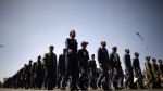 Yemeni air force personnel march during a protest calling for the resignation of their commander General Mohammad Saleh al-Ahmar in Sana’a on March 8, 2012.