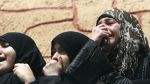 Relatives of Palestinians killed in Israeli airstrikes grieve in Gaza City, March 11, 2012.