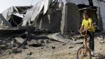 This file photo shows a Palestinian boy at the site of an Israeli airstrike in Gaza.