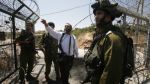 Jewish settlers shoot Palestinians as Israeli soldiers stand idle
